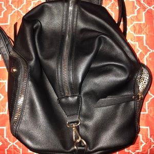 Black and leopard purse style backpack